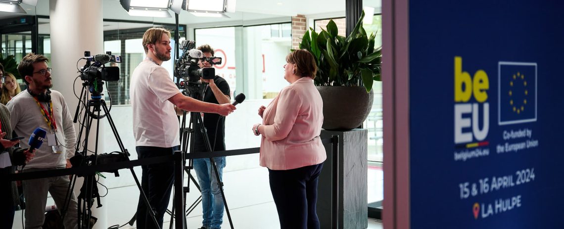 President Heather Roy talks to a camera crew